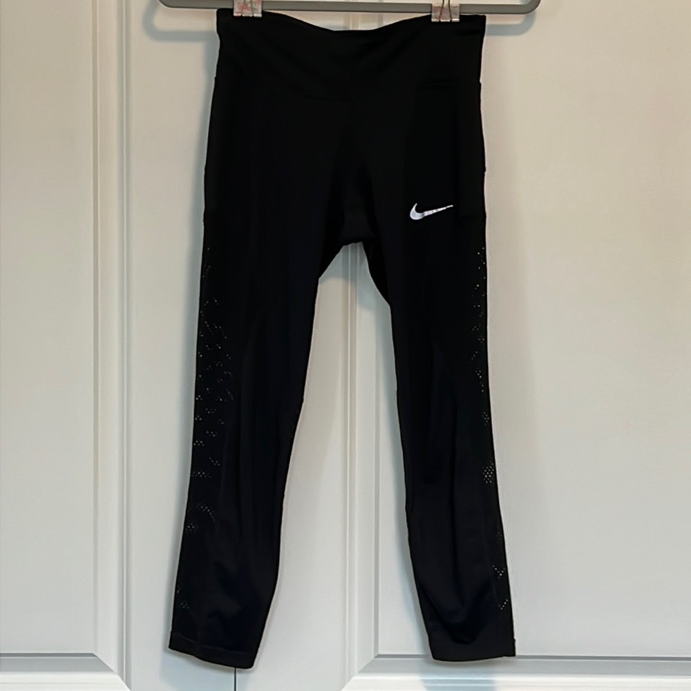 Nike. Gently used leggings. As is. Mesh cut out details. Size XS.